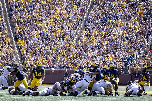 Khaleke Hudson (7), Jordan Anthony (34), Josh Uche (6), Carlo Kemp (2), Jordan Glasgow (29), Kwity Paye (19), and Lavert Hill (24)