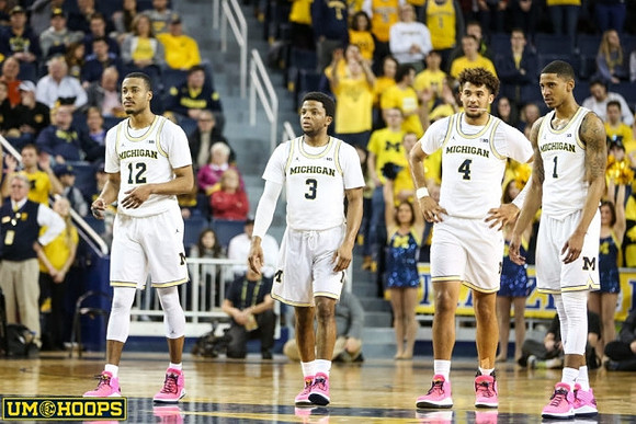 Muhammad-Ali Abdur-Rahkman (12), Zavier Simpson (3), Isaiah Livers (4), and Charles Matthews (1)