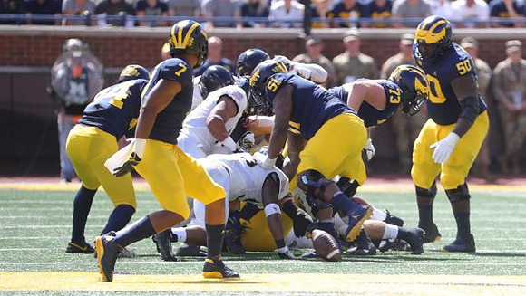Sean McKeon (84), Tarik Black (7), Cesar Ruiz (51), Jalen Mayfield (73), and Michael Onwenu (50)