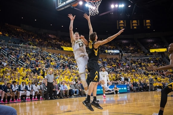 Moritz Wagner (13) and Isaiah Livers (4)