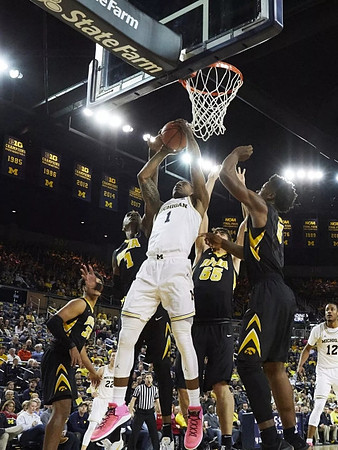 Charles Matthews (1), Duncan Robinson (22), and Muhammad-Ali Abdur-Rahkman (12)