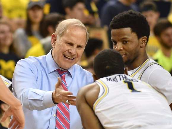 John Beilein, Charles Matthews (1), and Zavier Simpson (3)
