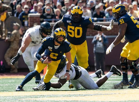 Shea Patterson (2), Michael Onwenu (50), and Cesar Ruiz (51)