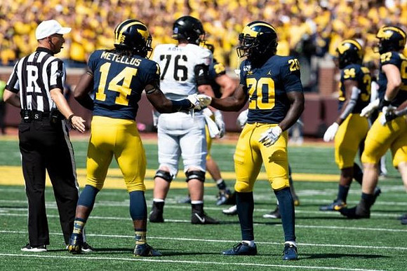 Josh Metellus (14), Brad Hawkins (20), Jordan Anthony (34), and Aidan Hutchinson (97)