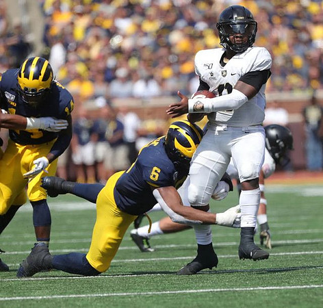 Josh Metellus (14) and Josh Uche (6)