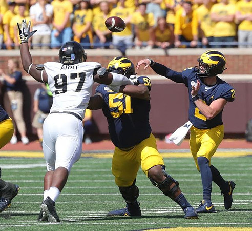 Cesar Ruiz (51) and Shea Patterson (2)
