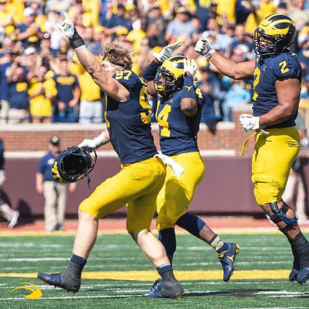 Aidan Hutchinson (97), Josh Metellus (14), and Carlo Kemp (2)