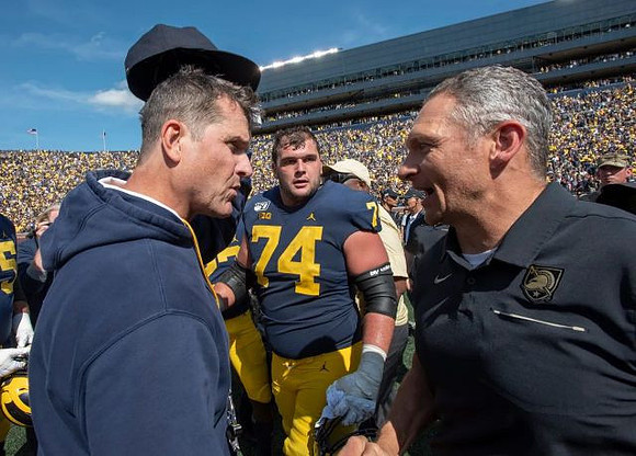 Jim Harbaugh, Ben Bredeson (74), and Army Head Coach Jeff Monken