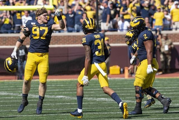Aidan Hutchinson (97), Vincent Gray (31), Josh Metellus (14), and Carlo Kemp (2)
