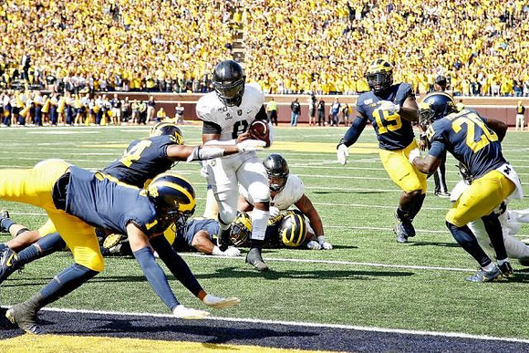 Ambry Thomas (1), Jordan Anthony (34), Aidan Hutchinson (97), Kwity Paye (19), and Brad Hawkins (20)