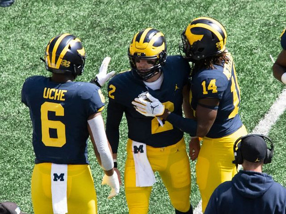 Josh Uche (6), Shea Patterson (2), Josh Metellus (14), and Jim Harbaugh