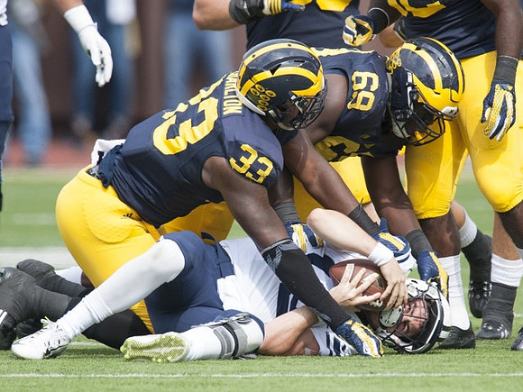 Taco Charlton (33) and Willie Henry (69)