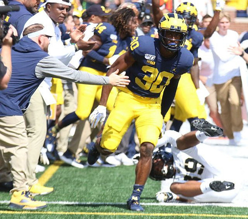 Josh Metellus (14) and Daxton Hill (30)