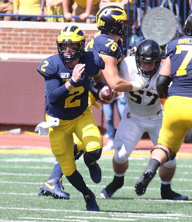 Shea Patterson (2), Ryan Hayes (76), and Ben Bredeson (74)