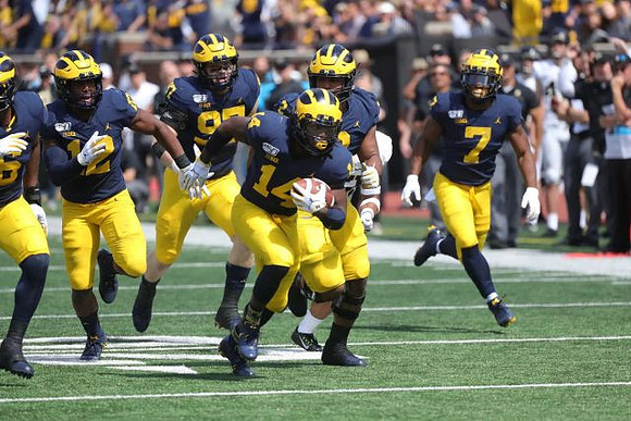 Josh Uche (6), Josh Ross (12), Aidan Hutchinson (97), Josh Metellus (14), Carlo Kemp (2), and Khaleke Hudson (7)