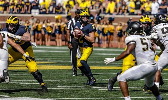 Jalen Mayfield (73) and Shea Patterson (2)