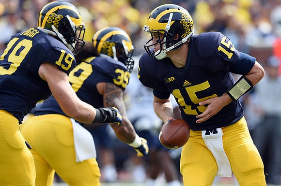 Henry Poggi (19), Sione Houma (39), and Jake Rudock (15)