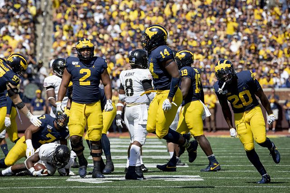 Aidan Hutchinson (97), Khaleke Hudson (7), Carlo Kemp (2), Josh Metellus (14), Kwity Paye (19), and Brad Hawkins (20)