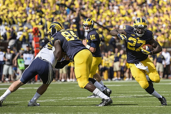 A.J. Williams (84), Jake Rudock (15), and Derrick Green (27)