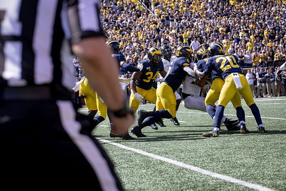 Jordan Anthony (34), Josh Uche (6), and Brad Hawkins (20)