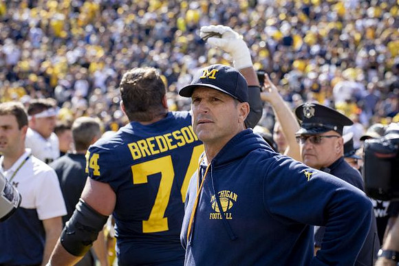 Ben Bredeson (74) and Jim Harbaugh