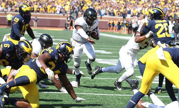Josh Uche (6), Kwity Paye (19), Jordan Anthony (34), and Brad Hawkins (20)