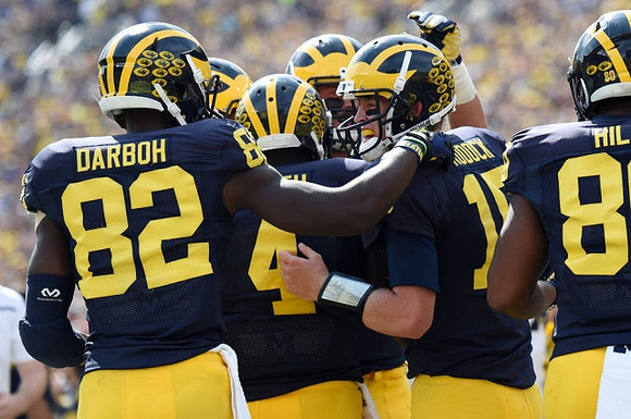 Amara Darboh (82), De'Veon Smith (4), Jake Rudock (15), and Khalid Hill (80)