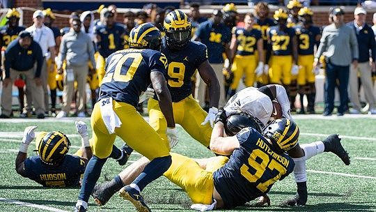 Khaleke Hudson (7), Brad Hawkins (20), Kwity Paye (19), and Aidan Hutchinson (97)
