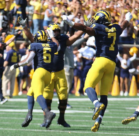 Josh Uche (6) and Khaleke Hudson (7)