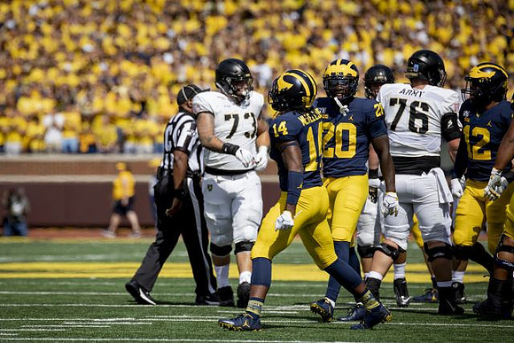 Josh Metellus (14), Brad Hawkins (20), and Josh Ross (12)