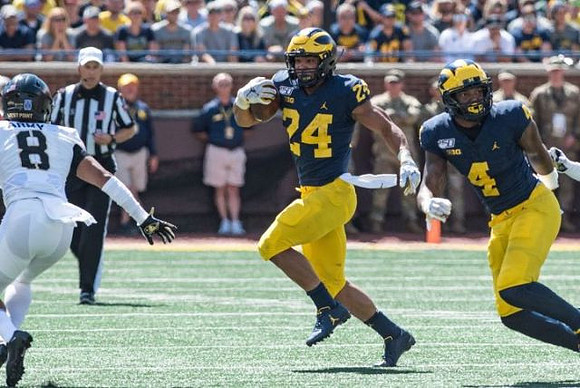 Zach Charbonnet (24) and Nico Collins (4)