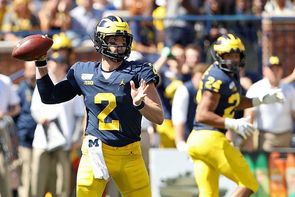 Shea Patterson (2) and Zach Charbonnet (24)