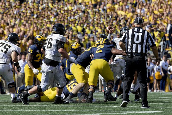 Jordan Anthony (34), Kwity Paye (19), Aidan Hutchinson (97), and Carlo Kemp (2)