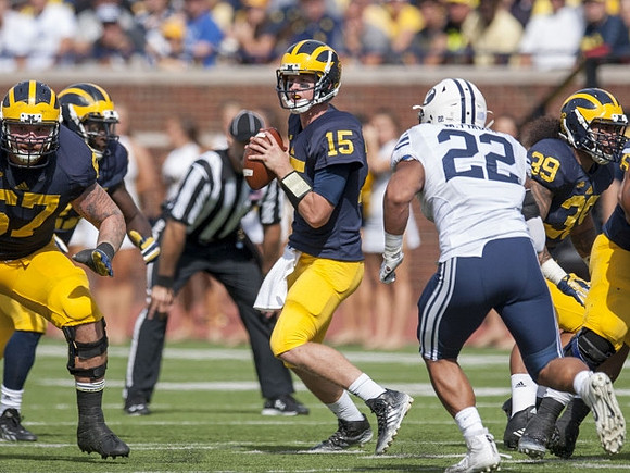 Kyle Kalis (67), Jake Rudock (15), and Sione Houma (39)