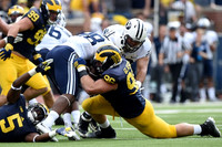 Matthew Godin (99), Jabrill Peppers (5), and Ryan Glasgow (96)