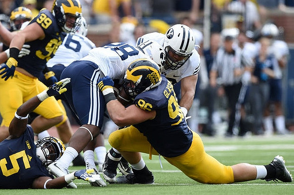 Matthew Godin (99), Jabrill Peppers (5), and Ryan Glasgow (96)