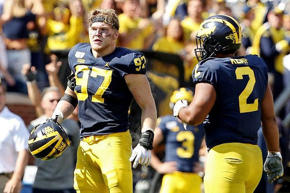 Aidan Hutchinson (97) and Carlo Kemp (2)