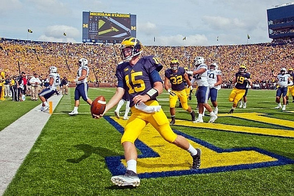 Jake Rudock (15), Ty Isaac (32), and Henry Poggi (19)