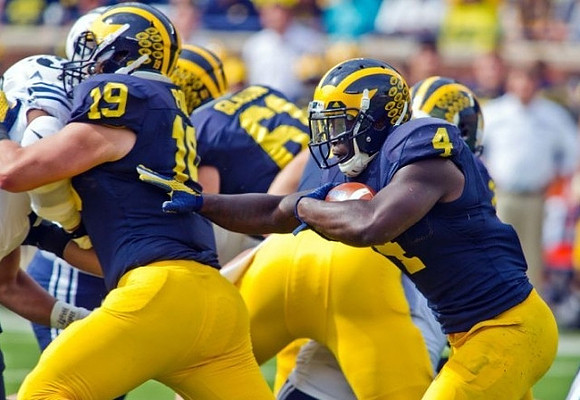 Henry Poggi (19), Graham Glasgow (61), and De'Veon Smith (4)