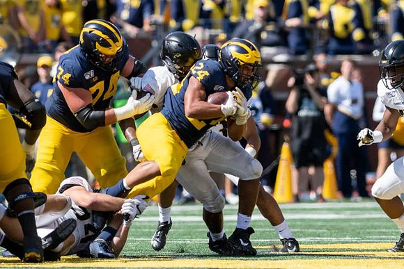 Ben Bredeson (74) and Zach Charbonnet (24)