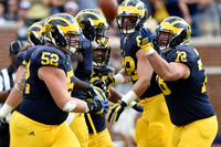 Mason Cole (52), Jake Butt (88), and Erik Magnuson (78)