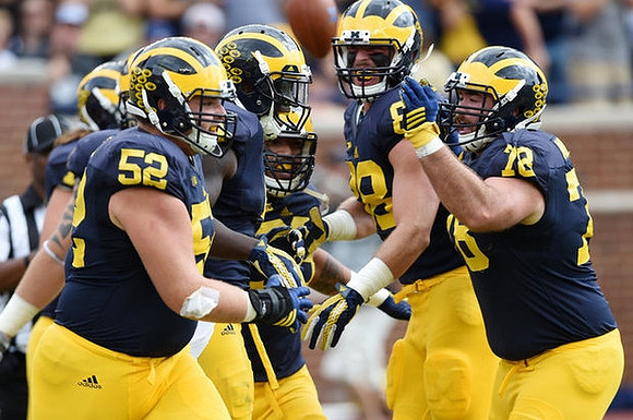 Mason Cole (52), Jake Butt (88), and Erik Magnuson (78)