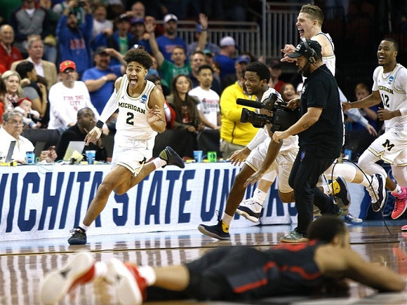Jordan Poole (2), Zavier Simpson (3), Moritz Wagner (13), and Muhammad-Ali Abdur-Rahkman (12)
