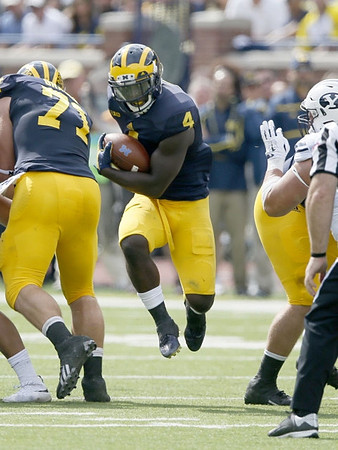 Ben Braden (71) and De'Veon Smith (4)