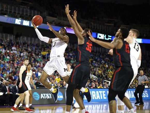 Jordan Poole (2), Zavier Simpson (3), and Moritz Wagner (13)