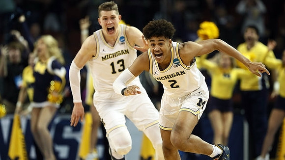 Moritz Wagner (13) and Jordan Poole (2)