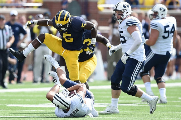Jabrill Peppers (5) and Mario Ojemudia (53)