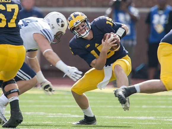 Kyle Kalis (67) and Jake Rudock (15)