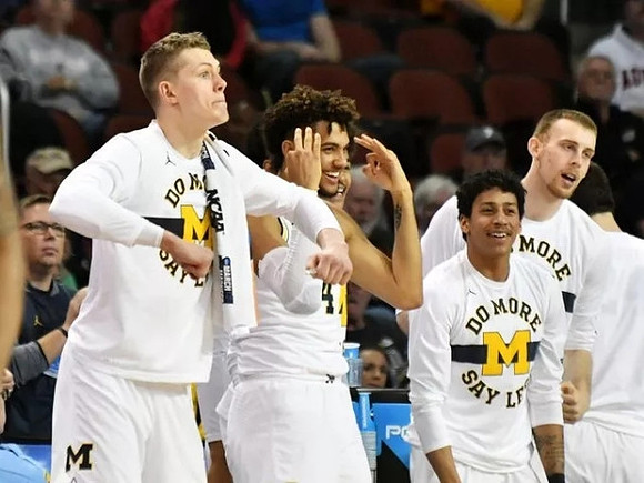 Moritz Wagner (13), Isaiah Livers (4), Eli Brooks (55), and Austin Davis (51)