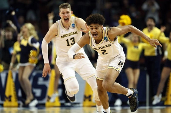 Moritz Wagner (13) and Jordan Poole (2)